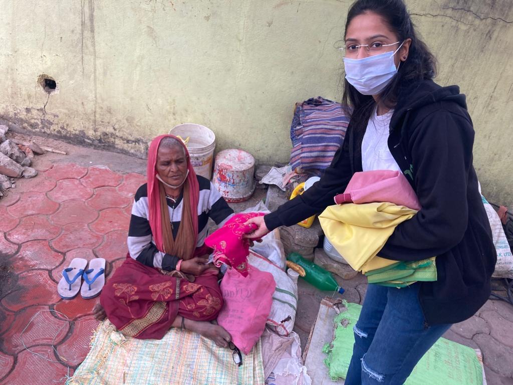 Distributing clothes to community members