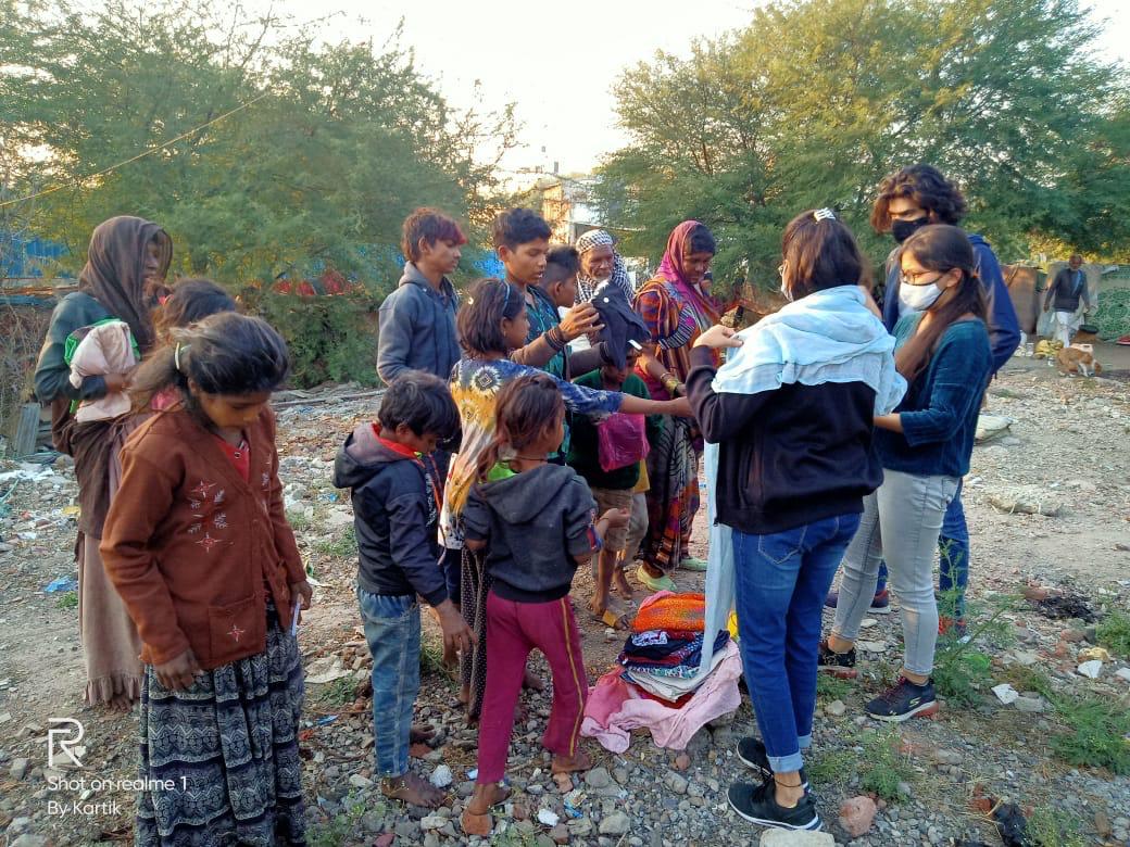 Volunteers distributing items to families