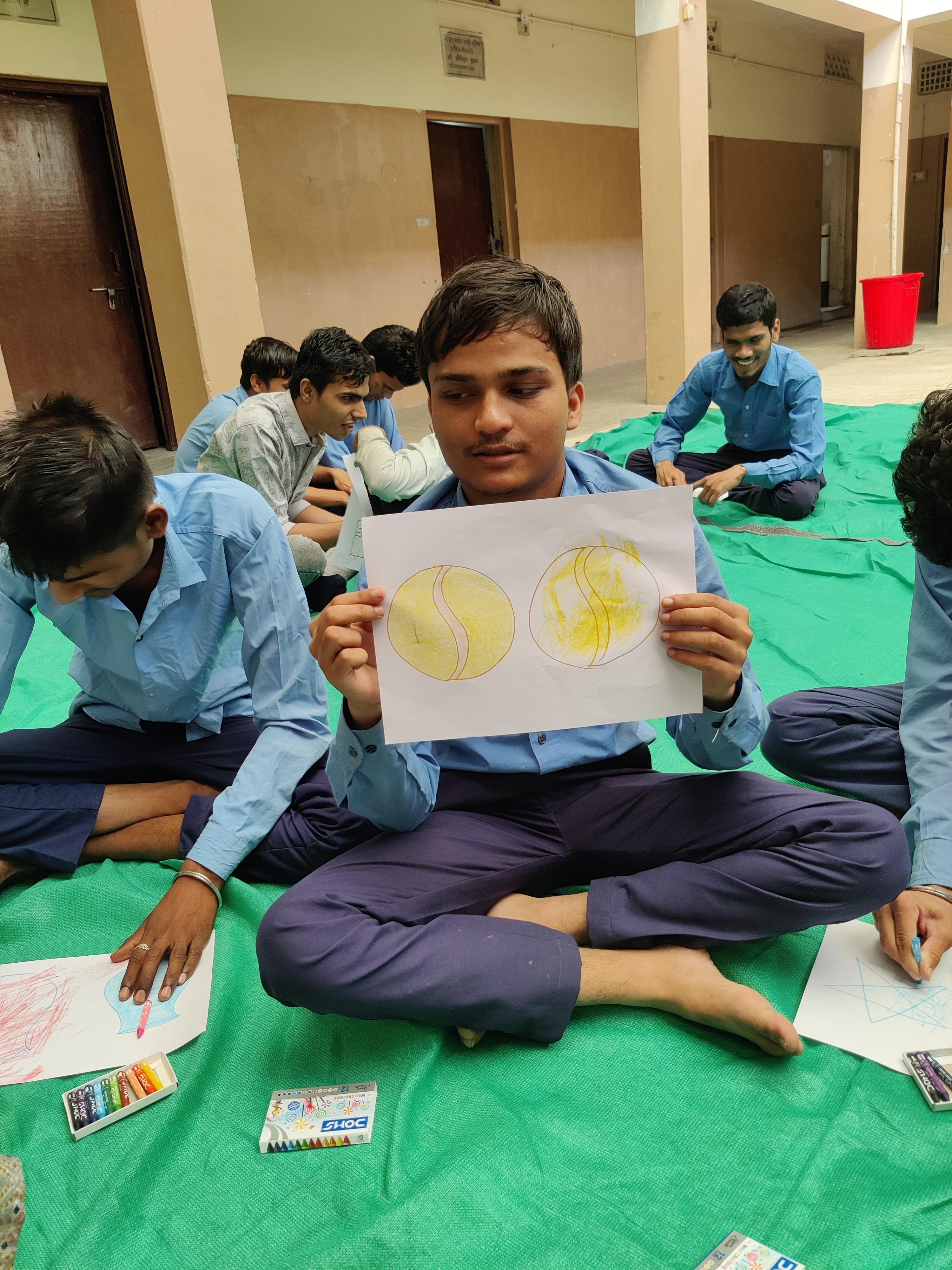 Student showing artwork